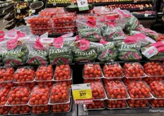 A tiered display of greenhouse-grown produce.