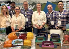 The Big Marble Farms team behind an array of its produce.